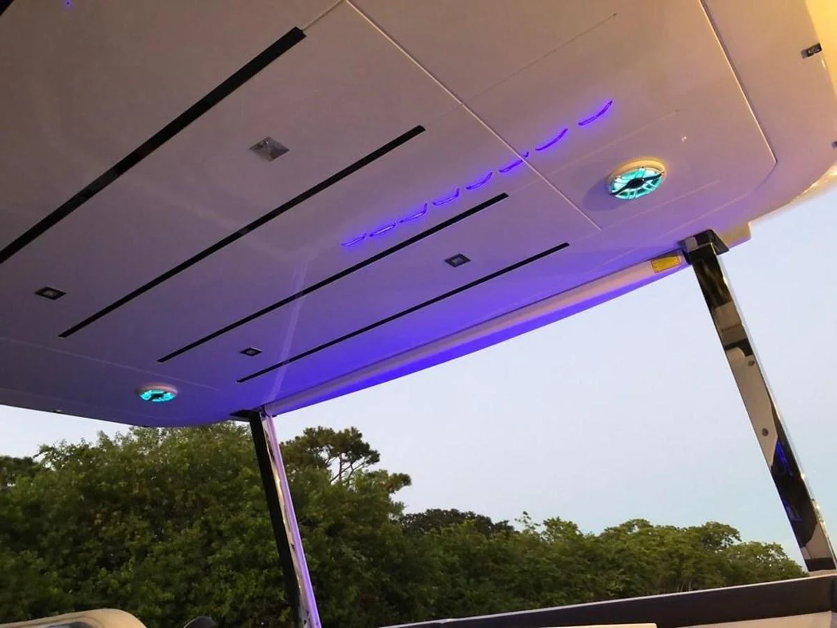 The image showcases the ceiling detail of a yacht with modern lighting and sleek design elements. aboard GODSPEED Yacht for Sale