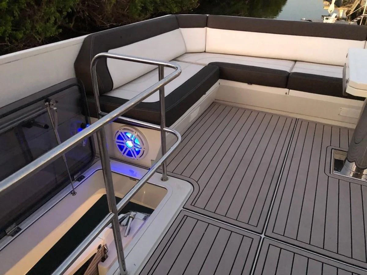The yacht's aft deck features comfortable seating and modern amenities for relaxation. aboard GODSPEED Yacht for Sale