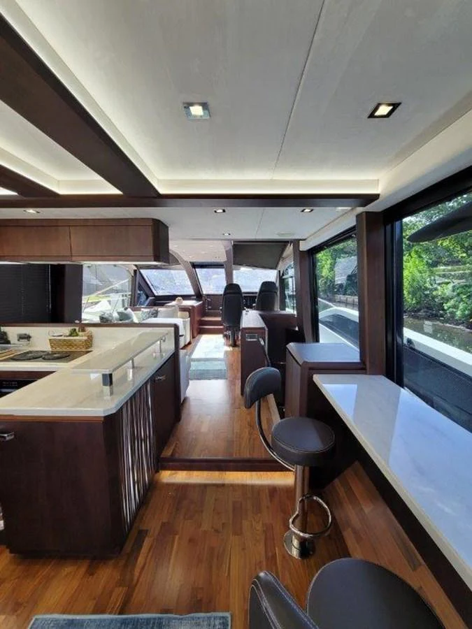The yacht's salon features luxurious seating and a modern design with ample natural light. aboard GODSPEED Yacht for Sale