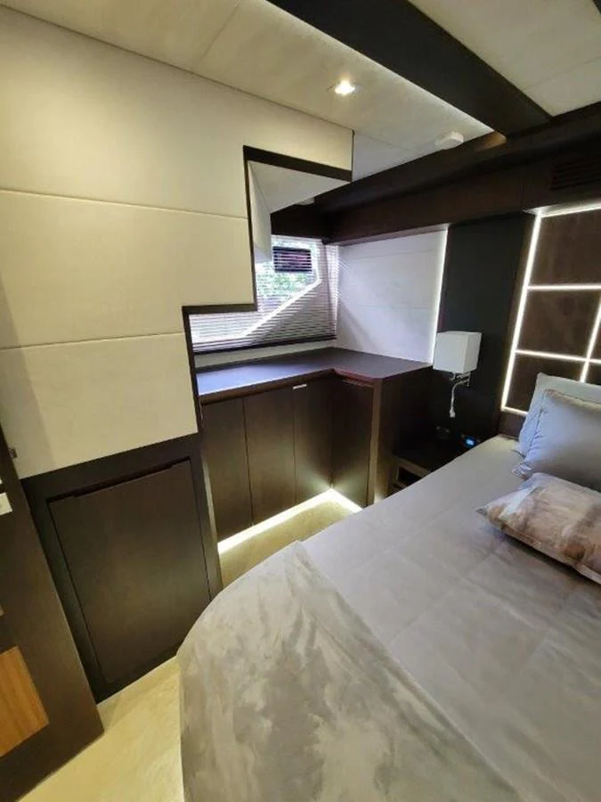 A cozy stateroom featuring modern design elements and soft lighting. aboard GODSPEED Yacht for Sale