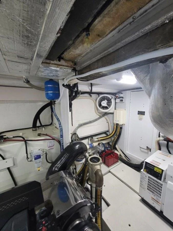 The image showcases the yacht's engine room with various mechanical components and equipment. aboard GODSPEED Yacht for Sale