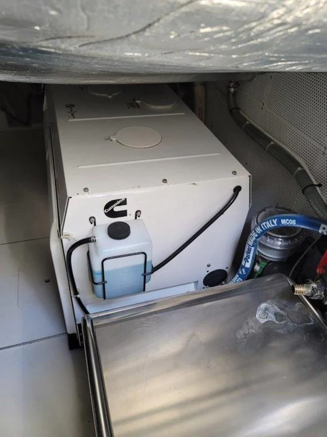 The image shows a detailed view of the yacht's engine room, highlighting the machinery and equipment. aboard GODSPEED Yacht for Sale