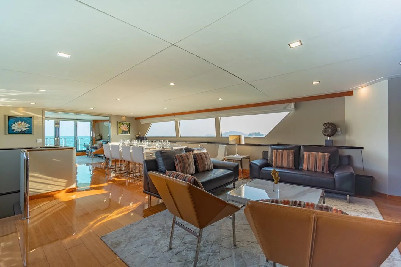 a living room with a couch and a table aboard NYMPHAEA Yacht for Sale