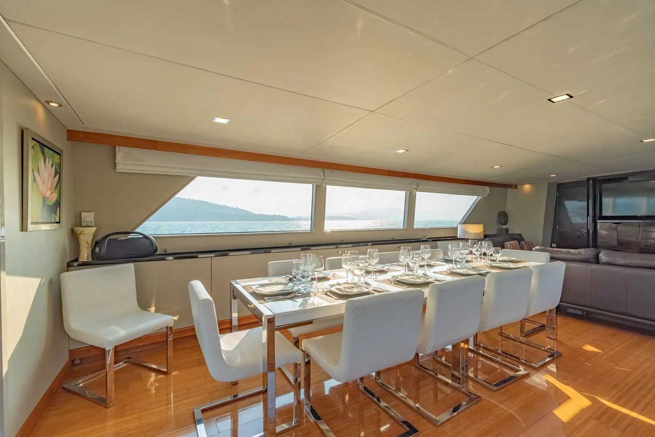 a large room with a table and chairs aboard NYMPHAEA Yacht for Sale