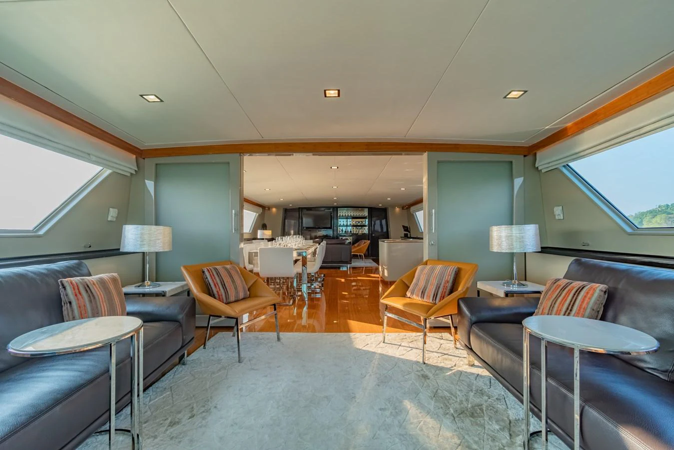 a living room with a large rug aboard NYMPHAEA Yacht for Sale