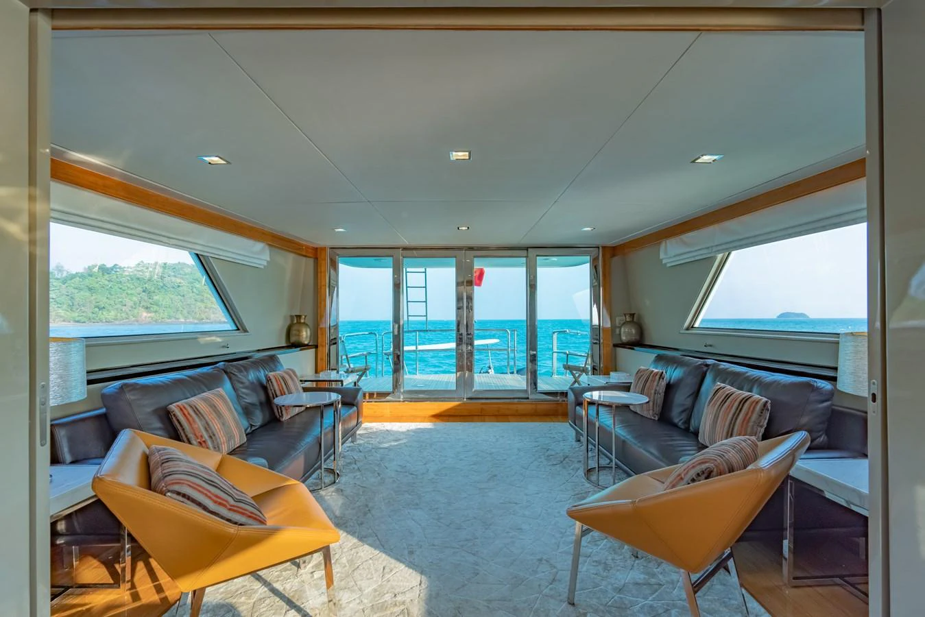 a living room with a large window aboard NYMPHAEA Yacht for Sale