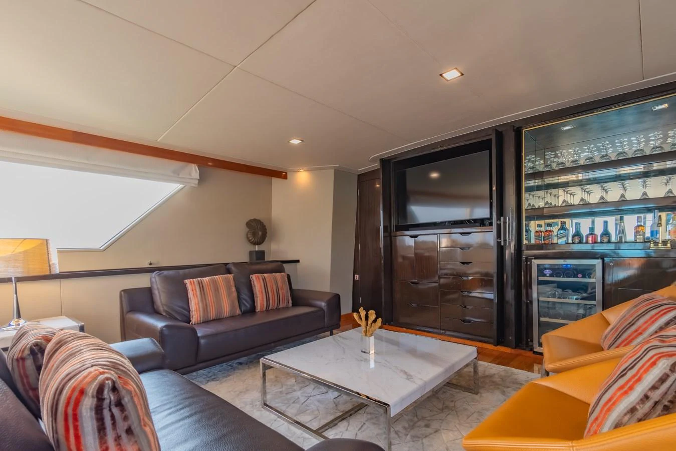 a living room with a large glass window aboard NYMPHAEA Yacht for Sale