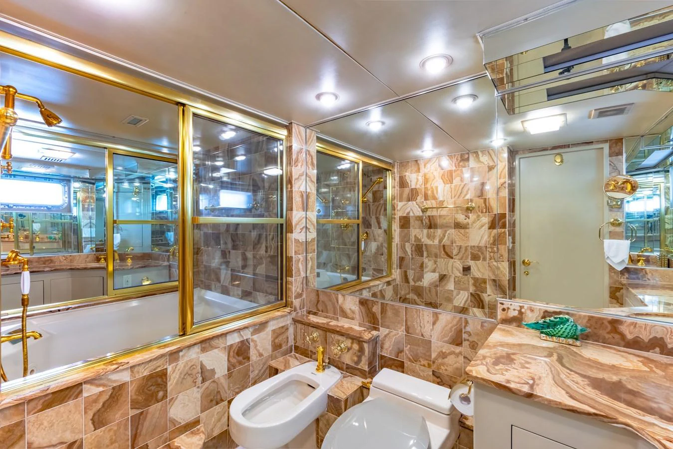 a bathroom with a large mirror aboard NYMPHAEA Yacht for Sale