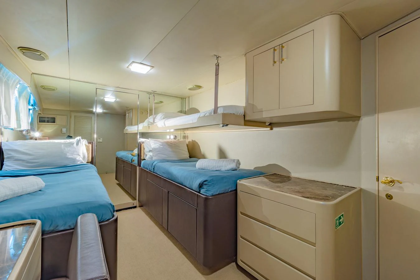 a room with a bed and a sink aboard NYMPHAEA Yacht for Sale