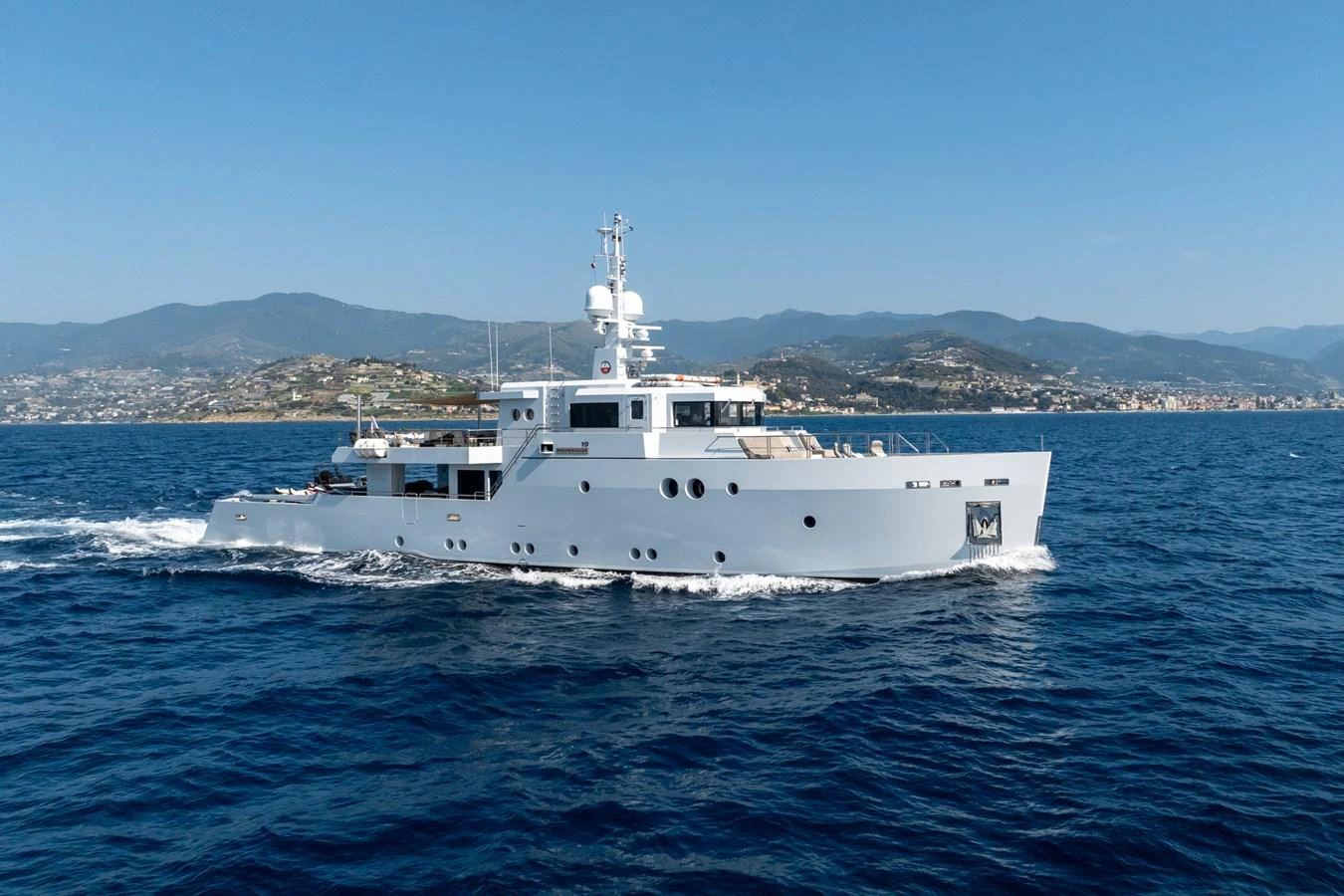 a white boat on the water aboard PREFERENCE 19 Yacht for Sale
