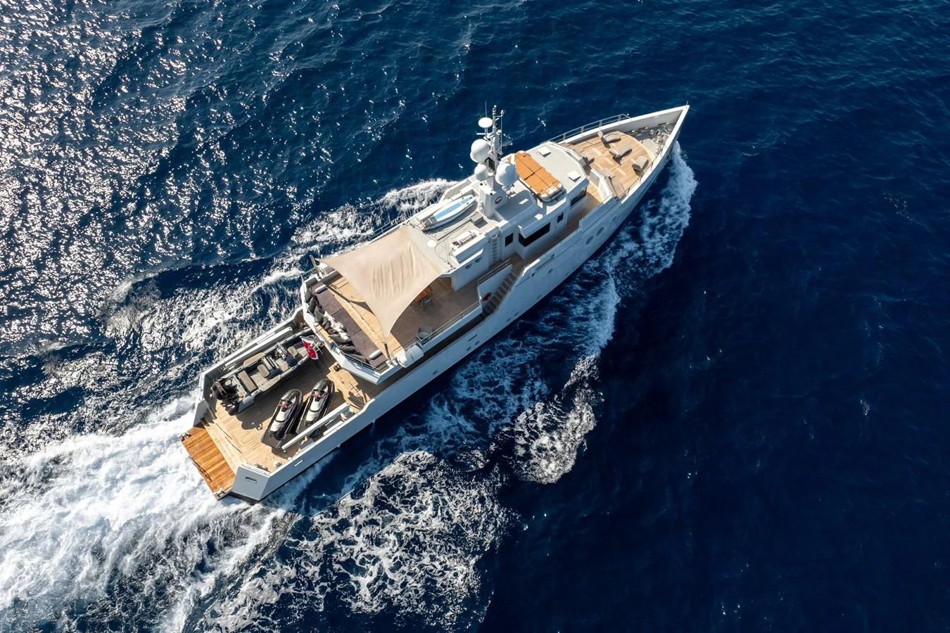 a helicopter flying over a body of water aboard PREFERENCE 19 Yacht for Sale