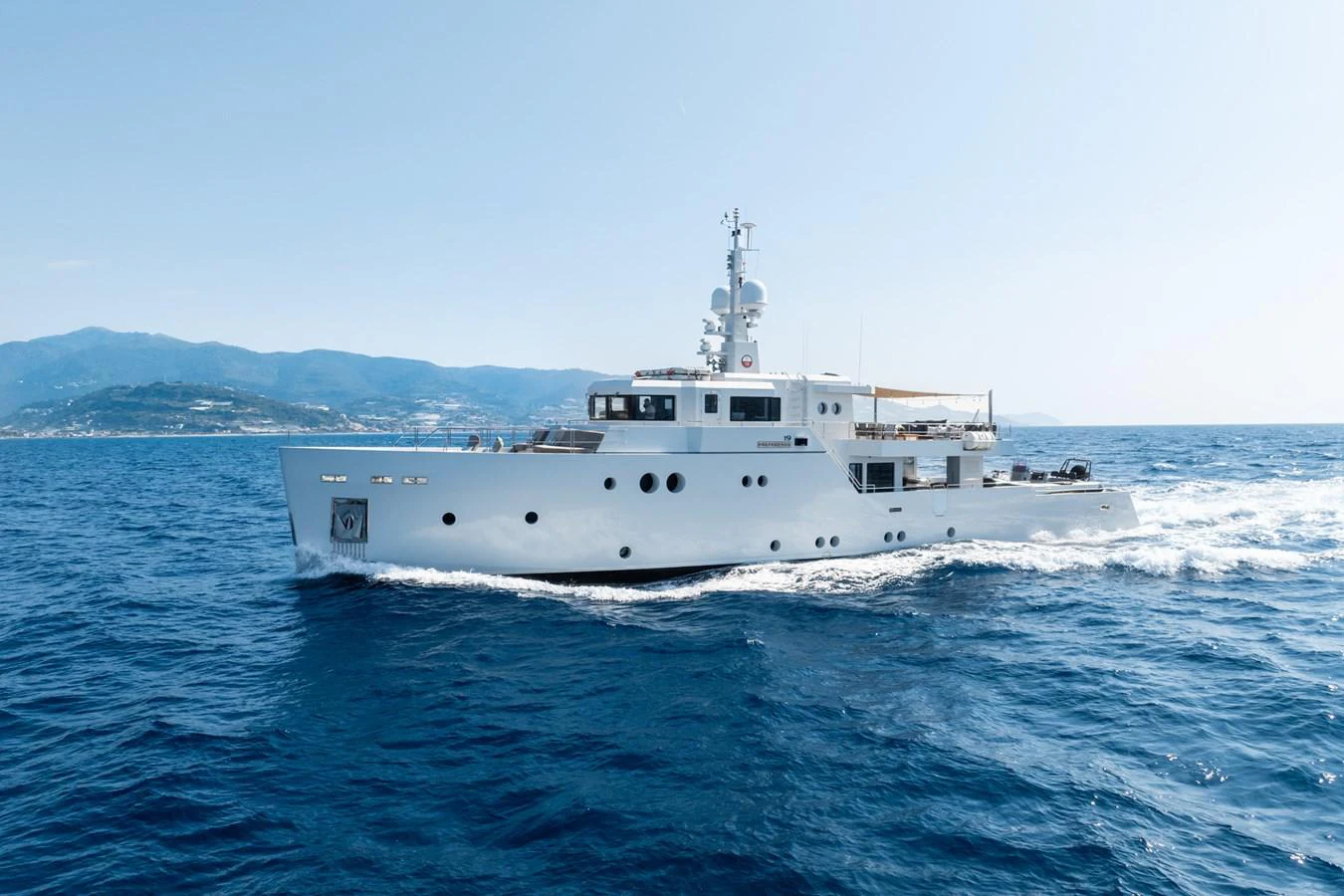 a white boat on the water aboard PREFERENCE 19 Yacht for Sale