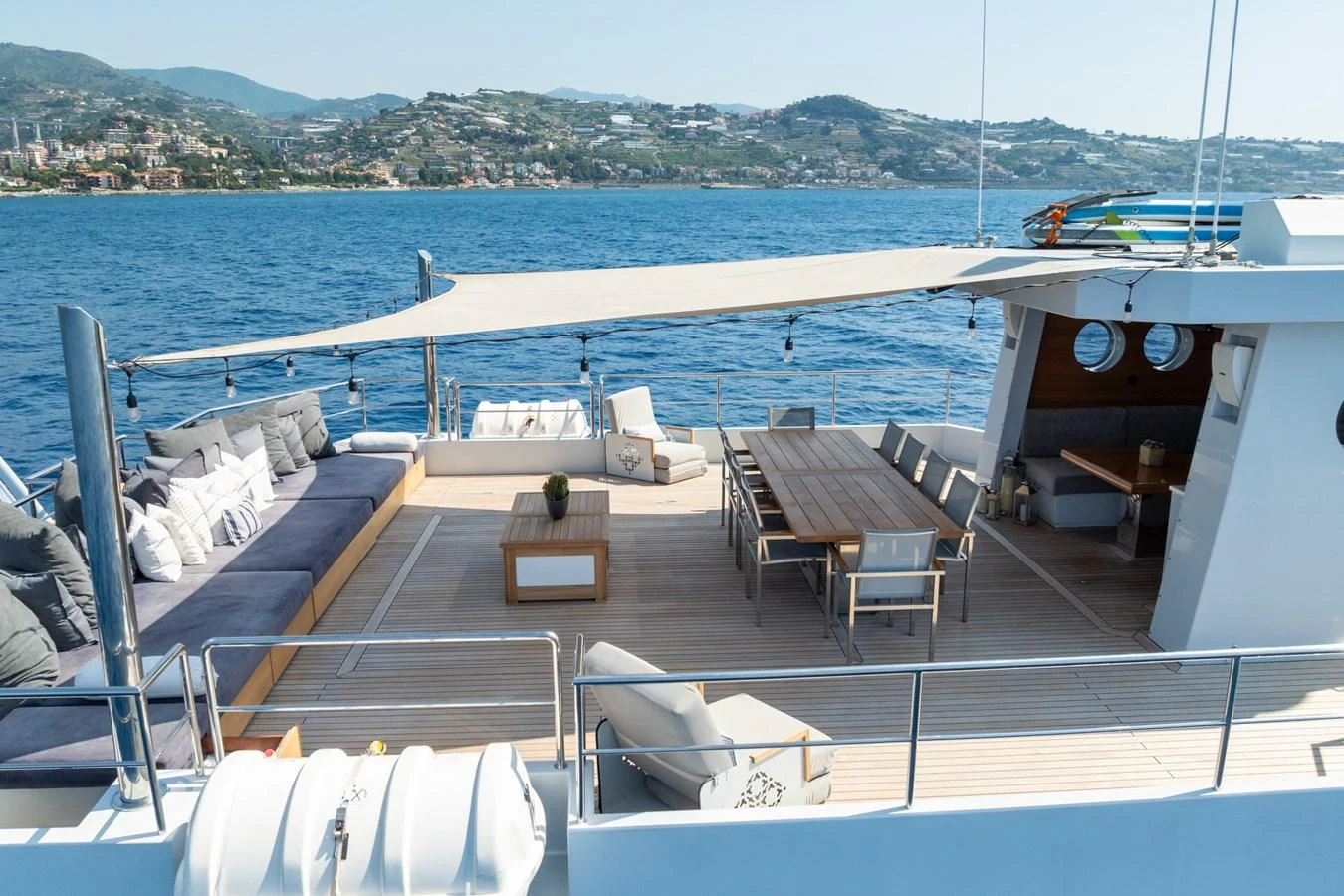 a deck with chairs on it by the water aboard PREFERENCE 19 Yacht for Sale
