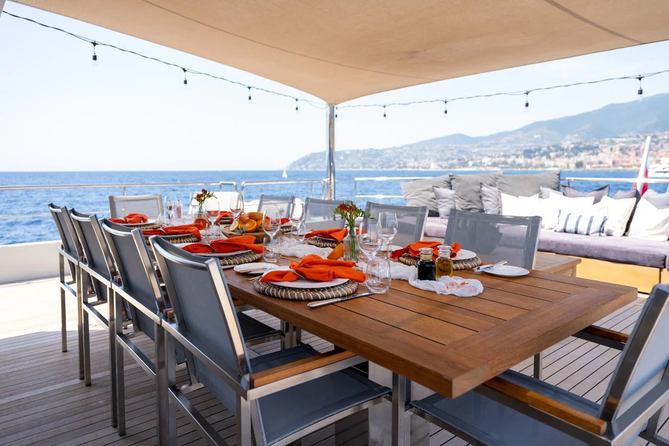 a table with plates and chairs on it aboard PREFERENCE 19 Yacht for Sale