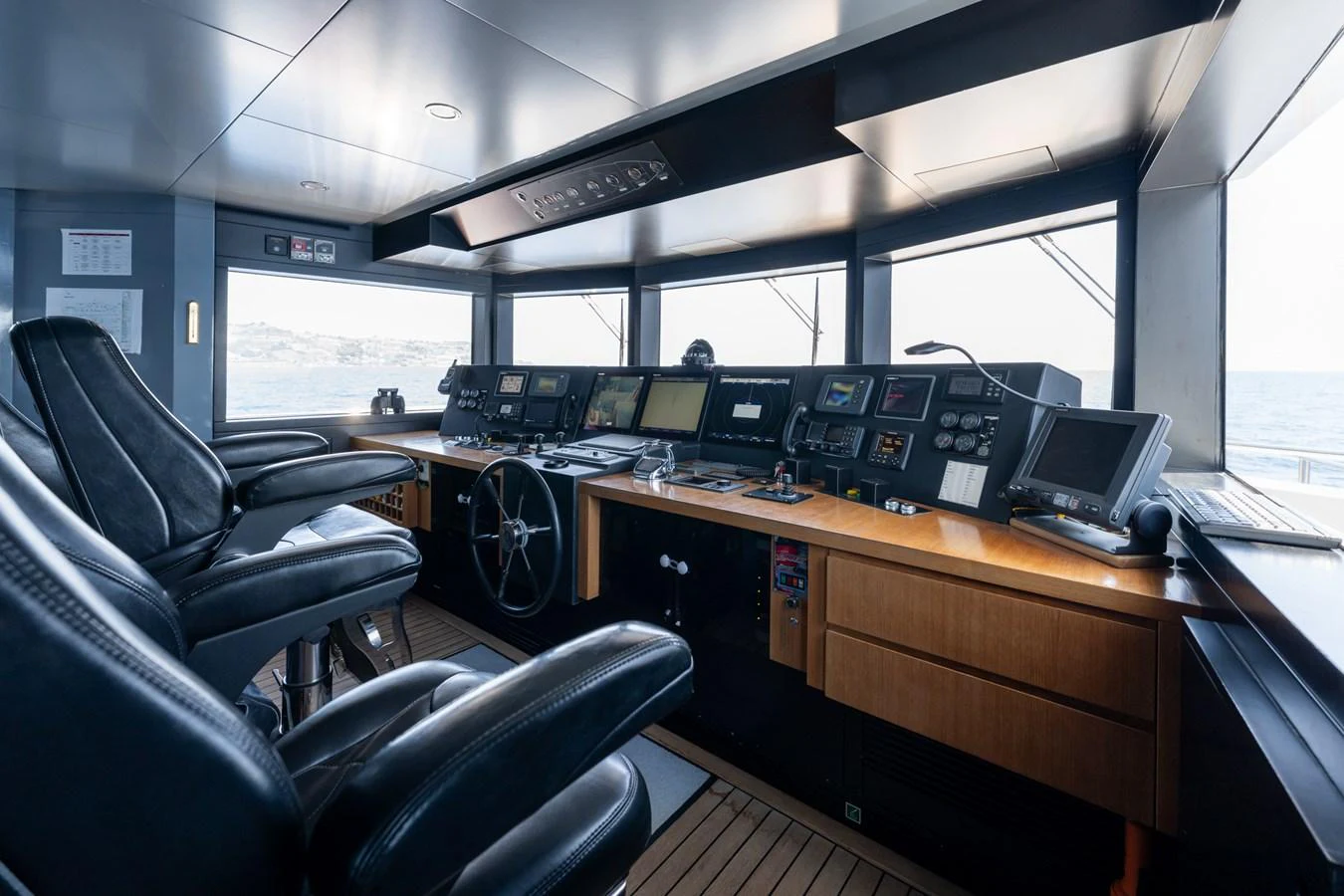 a room with computers and chairs aboard PREFERENCE 19 Yacht for Sale