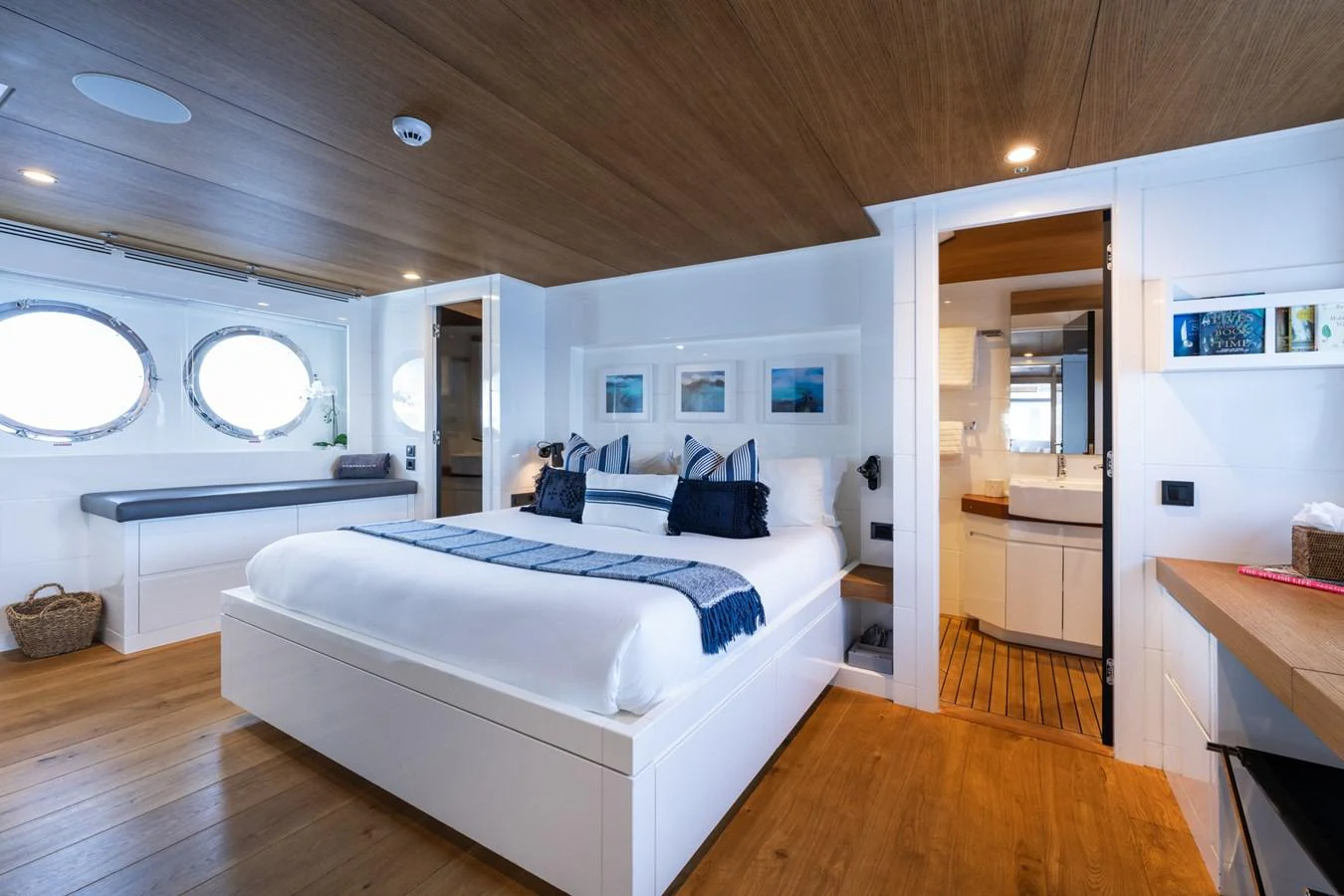 a bedroom with a bed and a desk aboard PREFERENCE 19 Yacht for Sale