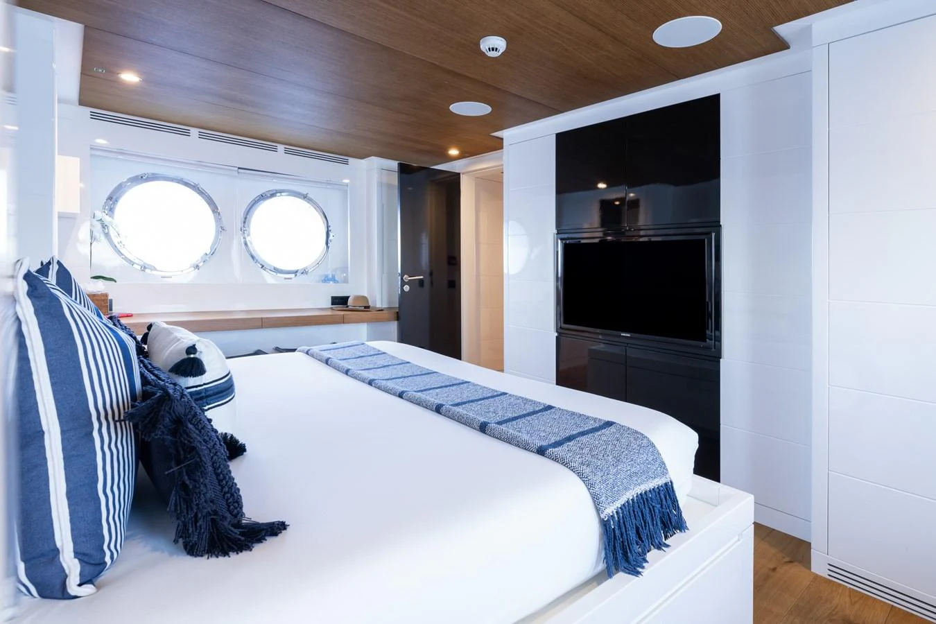 a bedroom with a bed and a tv aboard PREFERENCE 19 Yacht for Sale