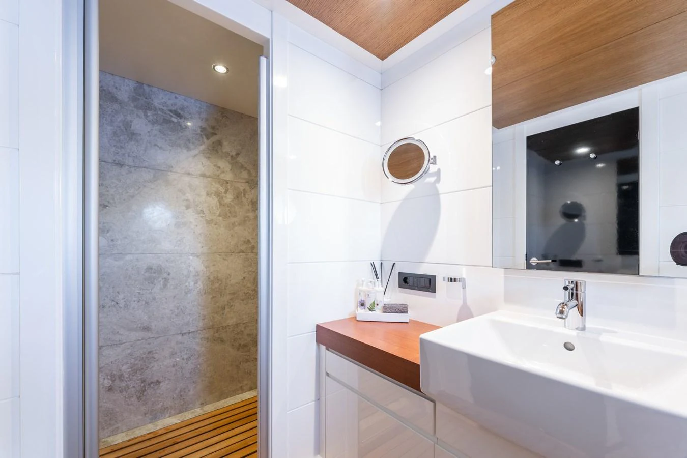 a bathroom with a large mirror aboard PREFERENCE 19 Yacht for Sale