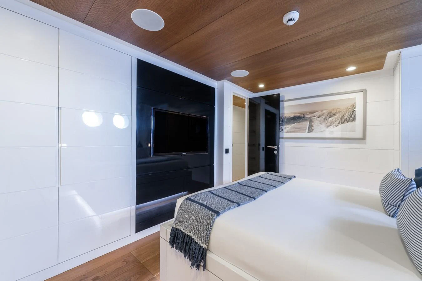 a bedroom with a bed and a tv aboard PREFERENCE 19 Yacht for Sale