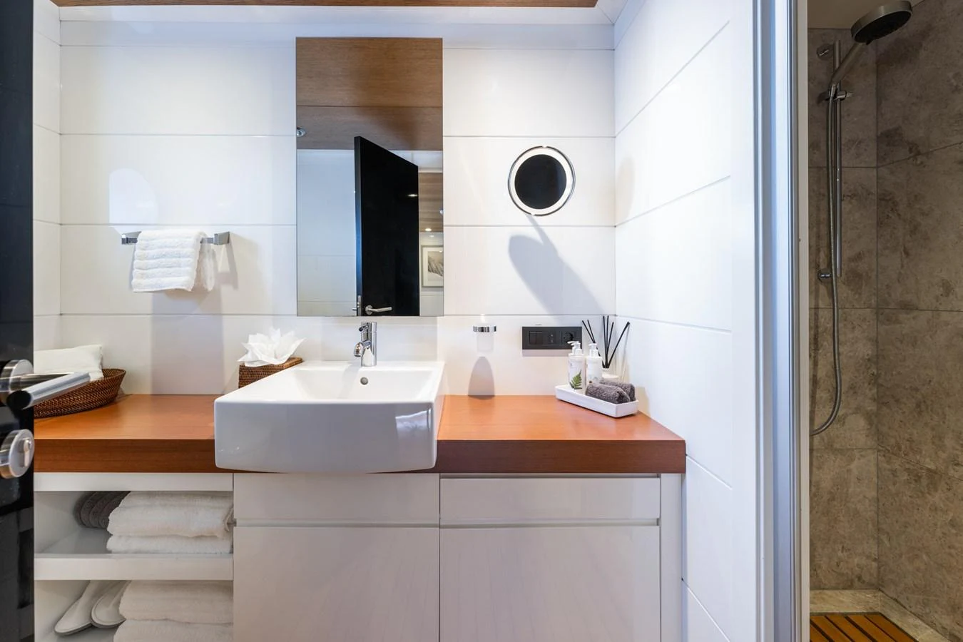 a bathroom with a sink and a mirror aboard PREFERENCE 19 Yacht for Sale