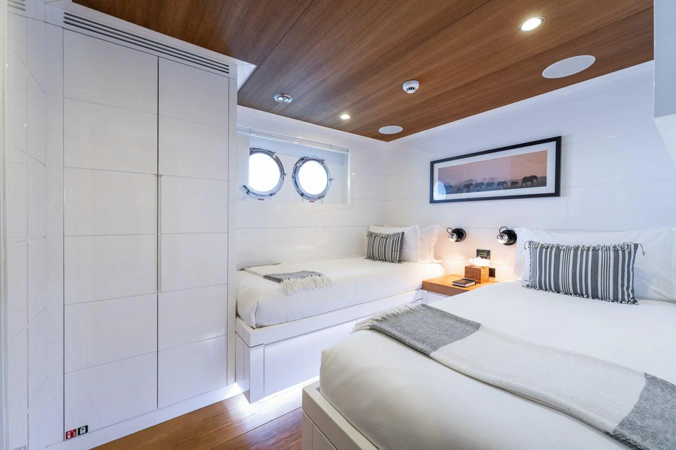 a room with two beds aboard PREFERENCE 19 Yacht for Sale