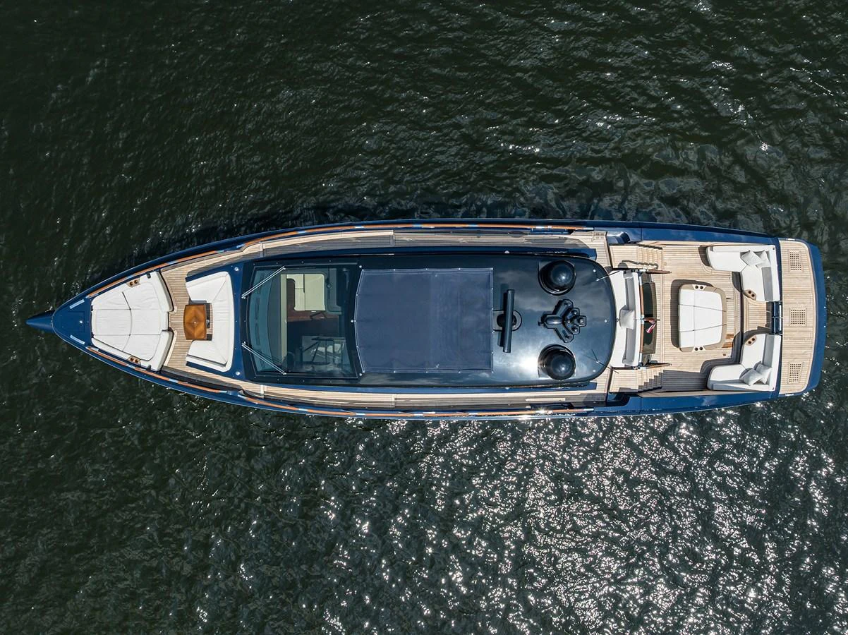 A sleek yacht is captured from an aerial view, showcasing its elegant design and spacious deck areas. aboard LAZZARA LSX 67 Yacht for Sale
