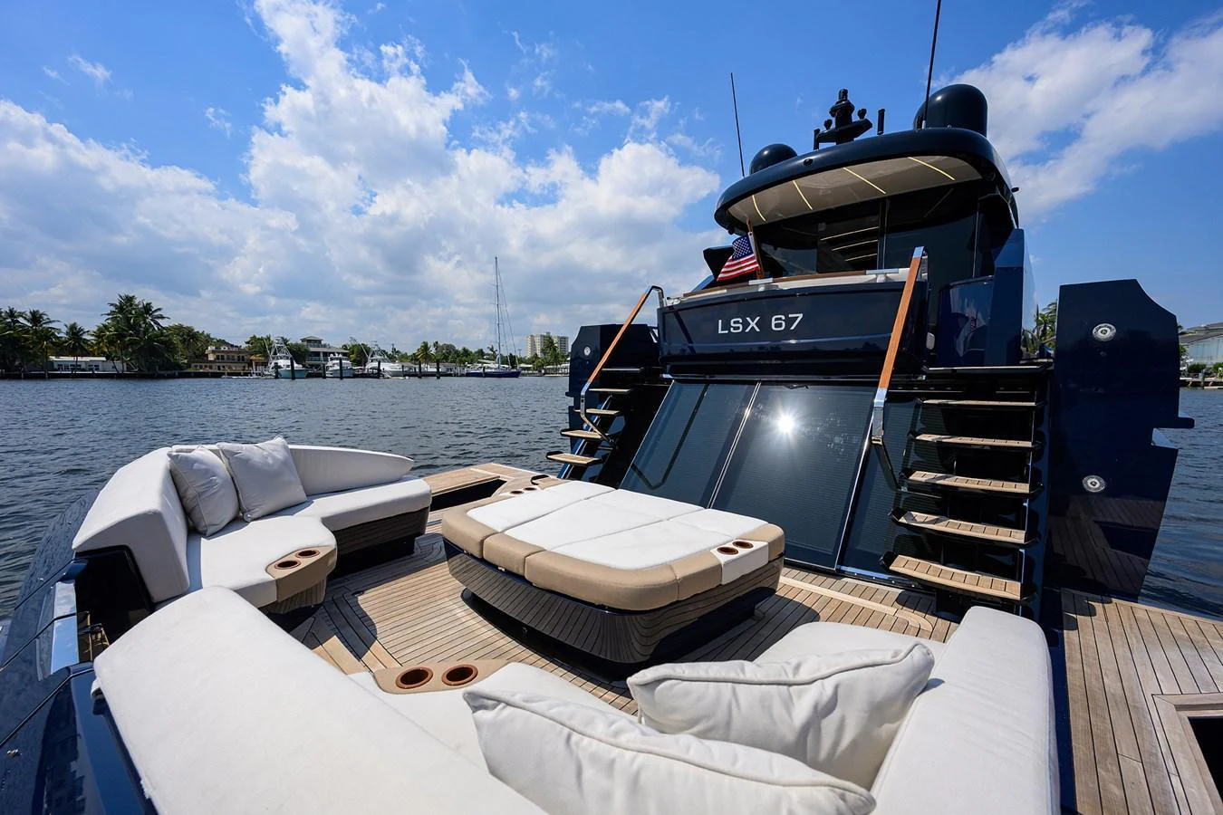 The yacht's aft deck features luxurious seating with plush cushions, perfect for relaxation and socializing. aboard LAZZARA LSX 67 Yacht for Sale