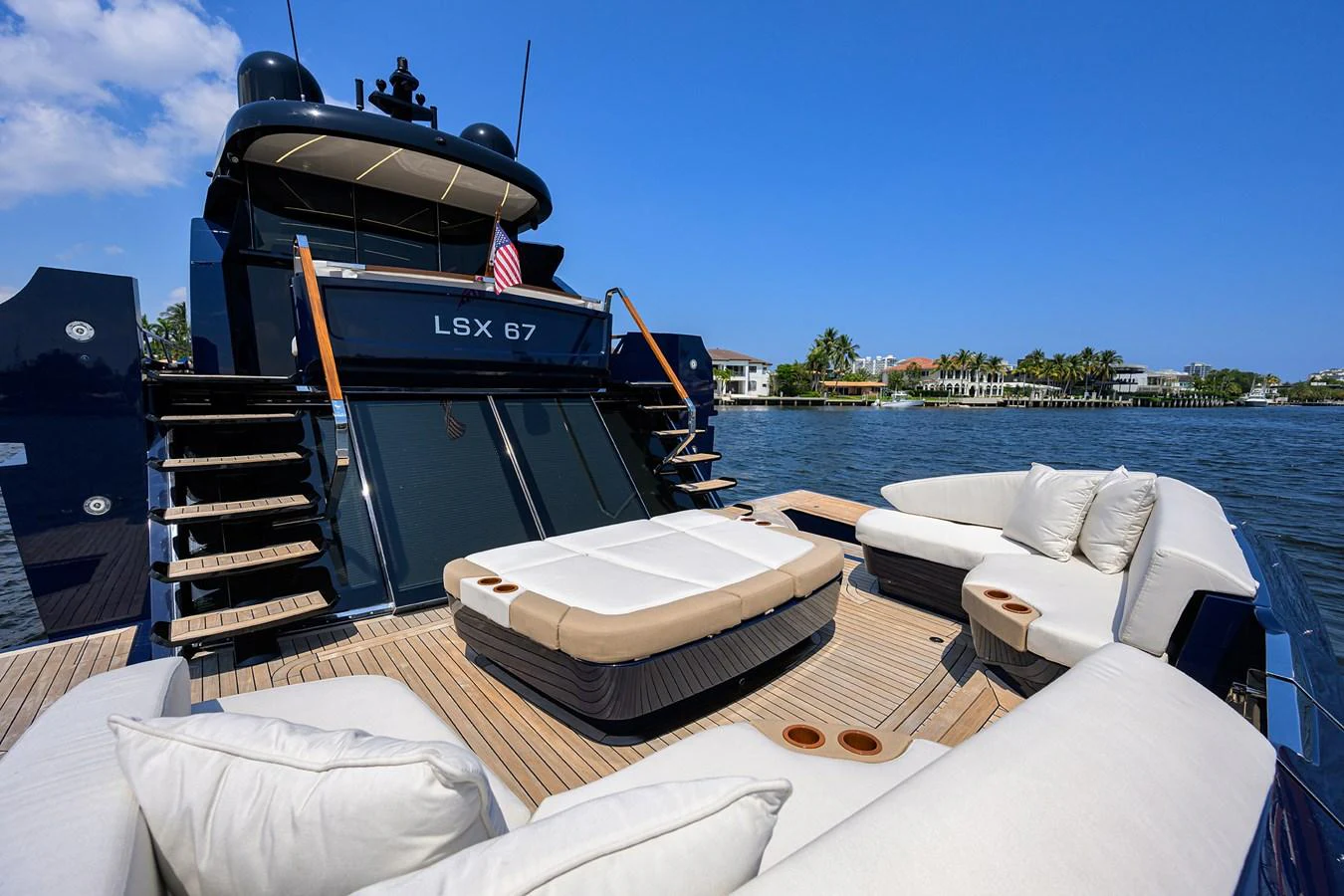 The aft deck features luxurious seating and a sunbed, perfect for relaxation and socializing. aboard LAZZARA LSX 67 Yacht for Sale