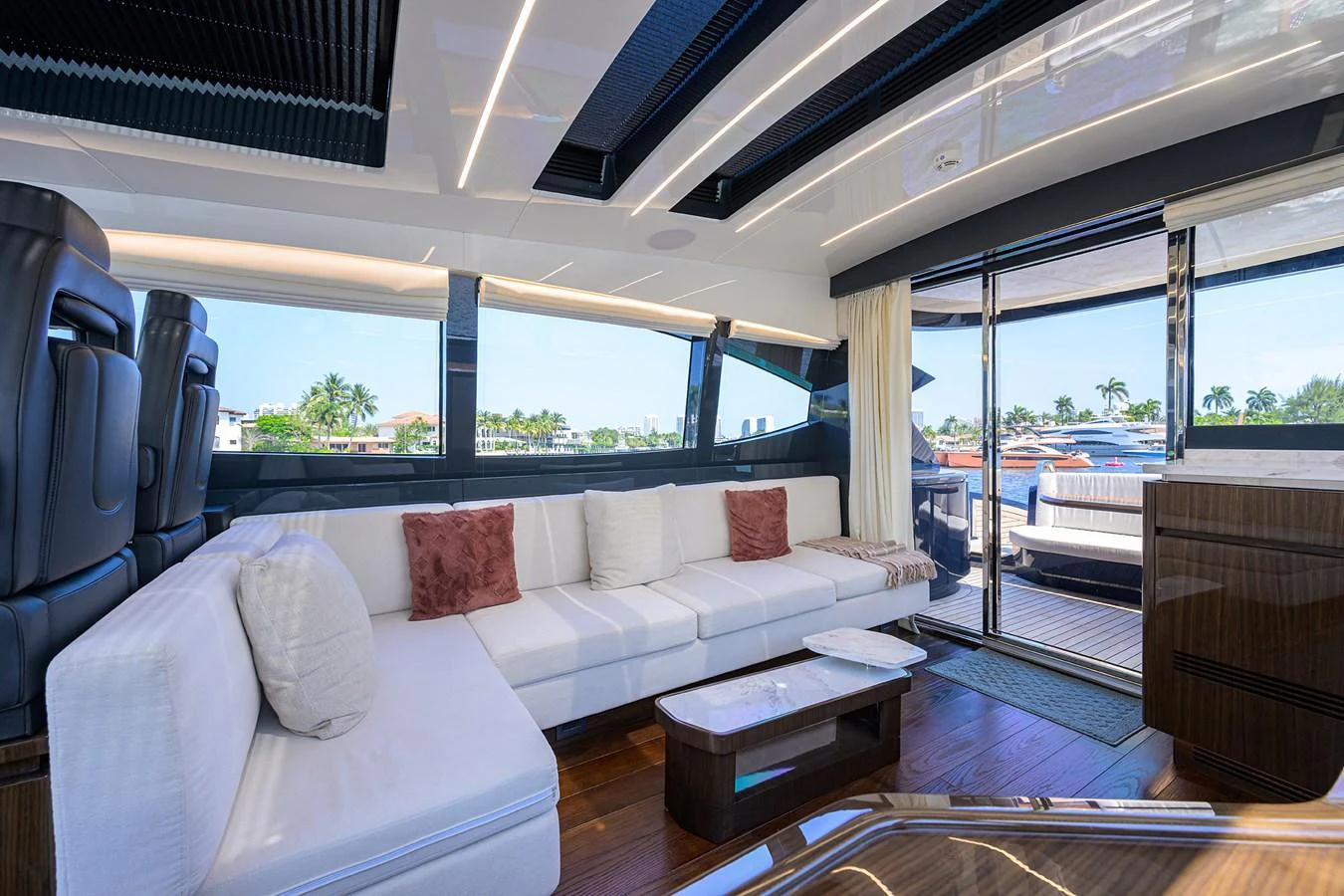 The luxurious salon features plush seating, modern decor, and ample natural light. aboard LAZZARA LSX 67 Yacht for Sale