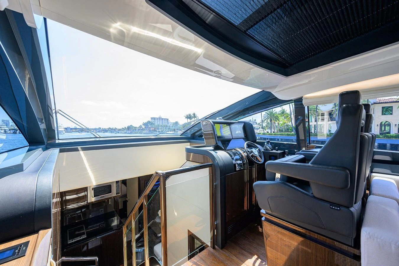 The helm area offers a panoramic view with luxurious seating and state-of-the-art navigation equipment. aboard LAZZARA LSX 67 Yacht for Sale