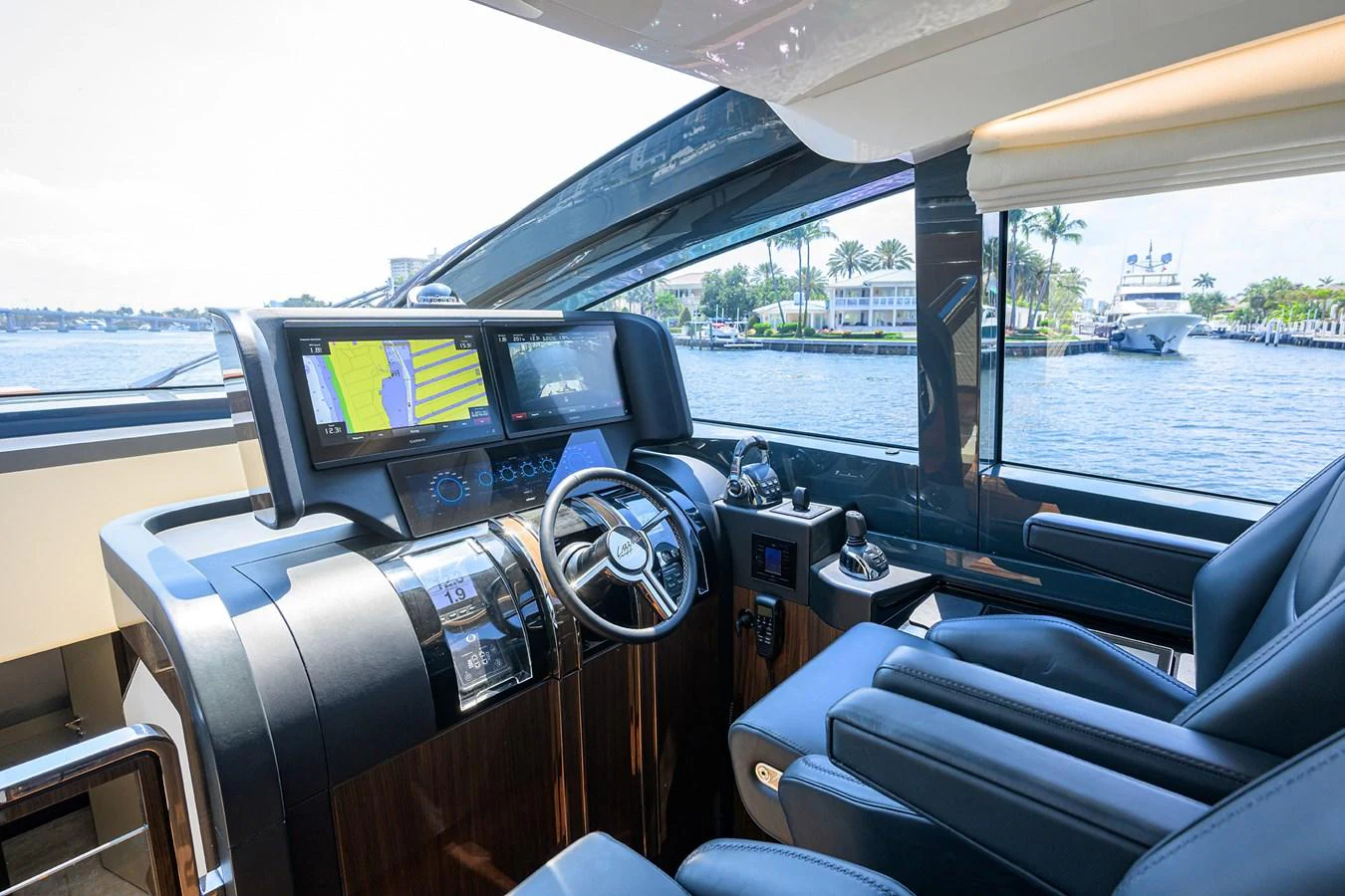 The helm station offers a commanding view with advanced navigation equipment and luxurious seating. aboard LAZZARA LSX 67 Yacht for Sale