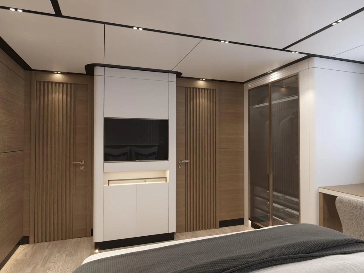 The stateroom features modern design elements with sleek wood paneling and a built-in entertainment unit. aboard STELLARONE ST88/01 Yacht for Sale