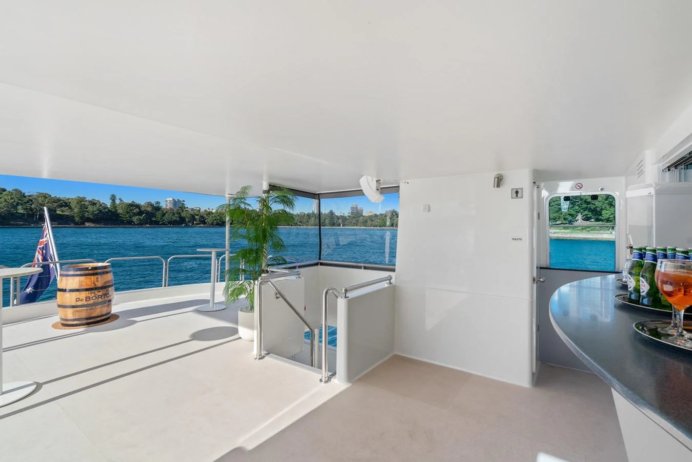 The aft deck offers a spacious and open area with a beautiful view of the water, perfect for relaxation and socializing. aboard COAST Yacht for Sale