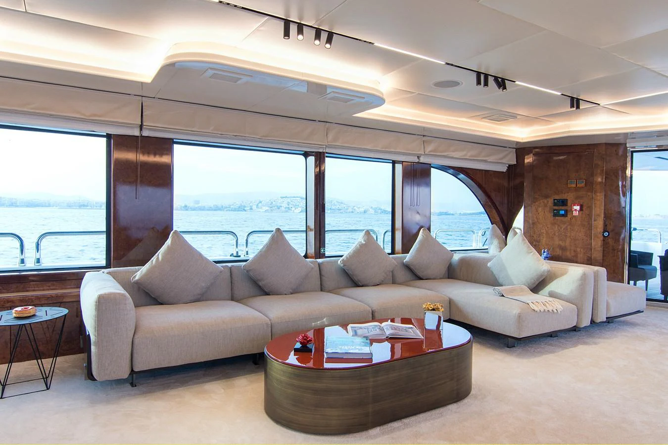 a living room with a couch and a table aboard HALLO Yacht for Sale