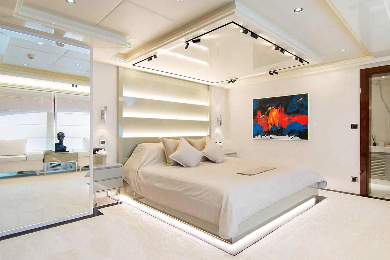 a room with a bed and a television aboard HALLO Yacht for Sale