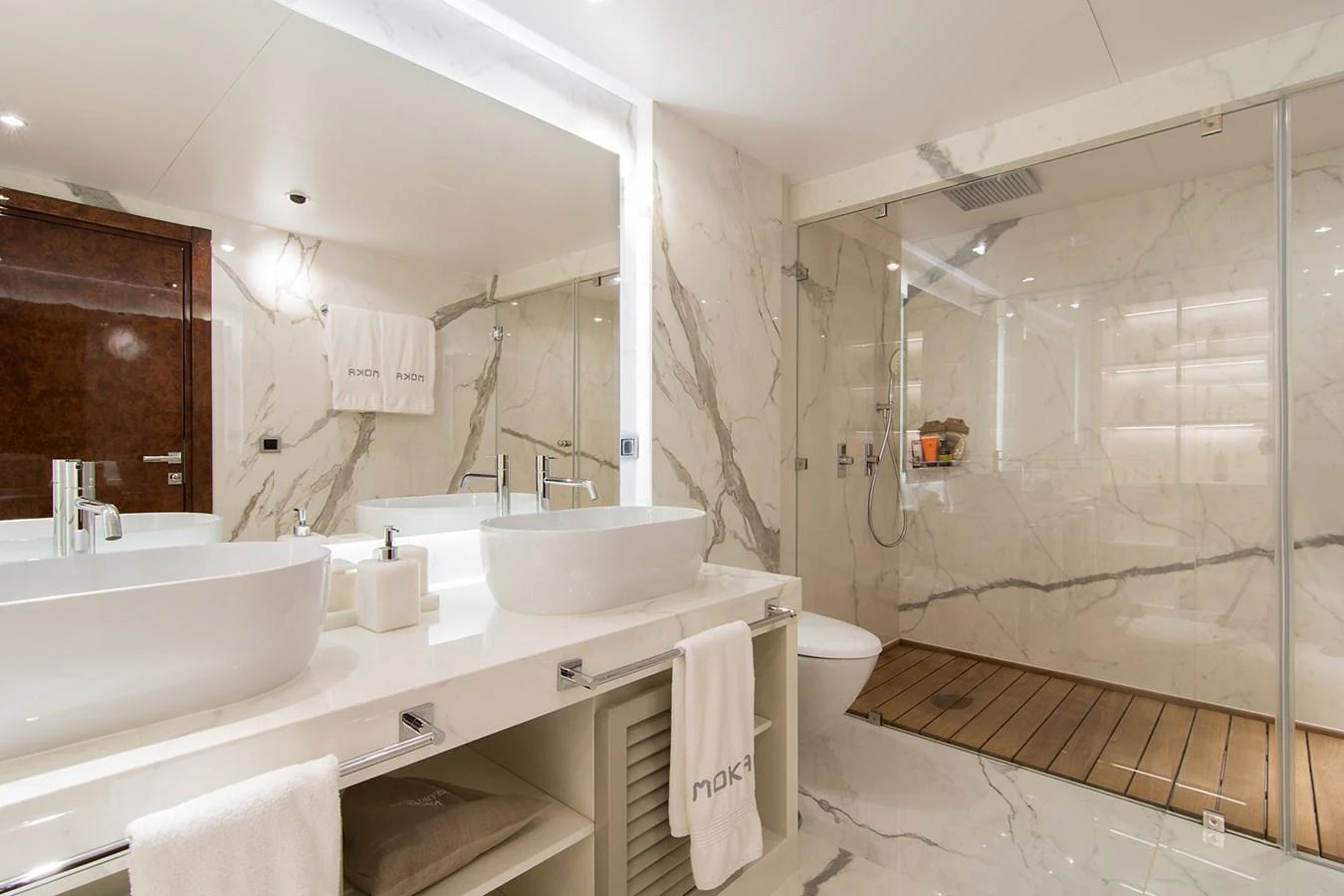 a bathroom with a glass shower aboard HALLO Yacht for Sale