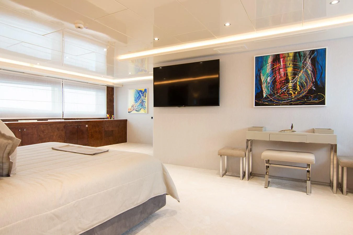 a room with a bed and a desk aboard HALLO Yacht for Sale