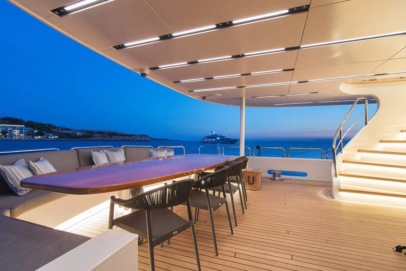 a room with a pool and a deck with a view of the water aboard HALLO Yacht for Sale