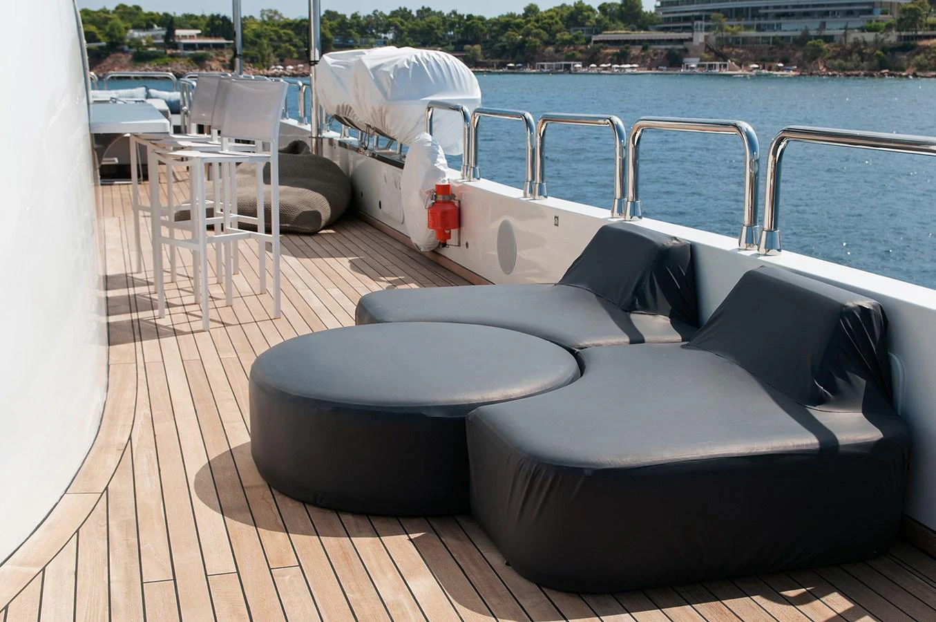 a deck with a couch and chairs on it aboard HALLO Yacht for Sale