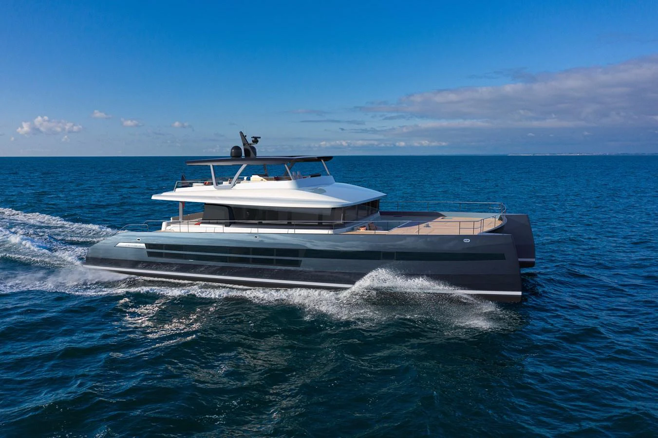 A sleek and modern yacht glides effortlessly across the open sea under a clear blue sky. aboard LONG ISLAND Yacht for Sale