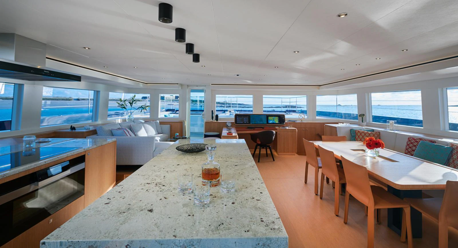 The spacious salon offers panoramic views and a blend of modern and comfortable furnishings. aboard LONG ISLAND 78 Yacht for Sale