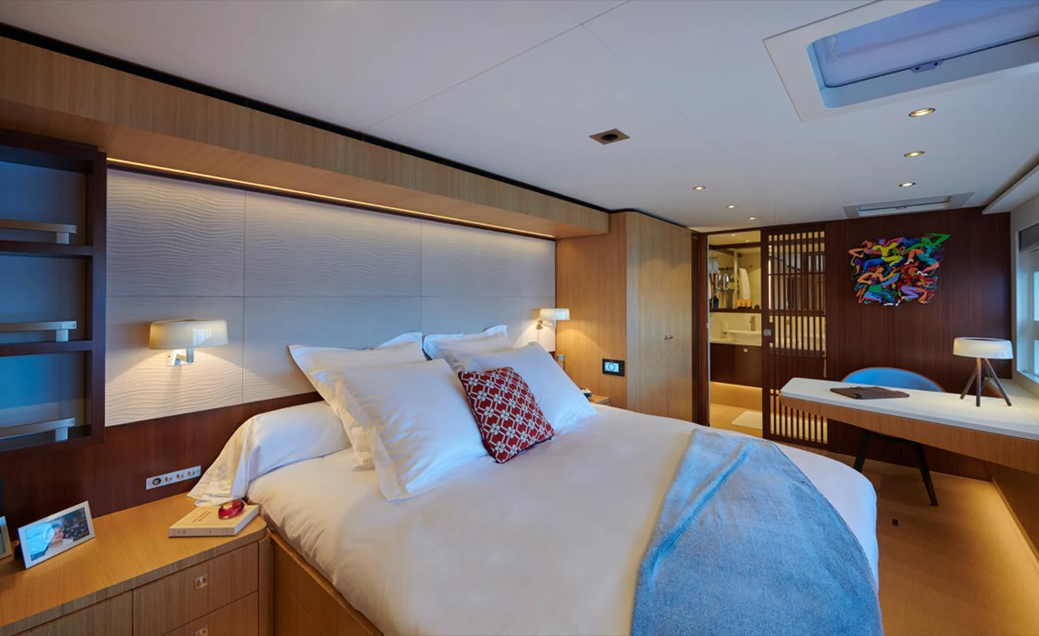 The master stateroom features a luxurious bed, modern lighting, and elegant decor. aboard LONG ISLAND 78 Yacht for Sale