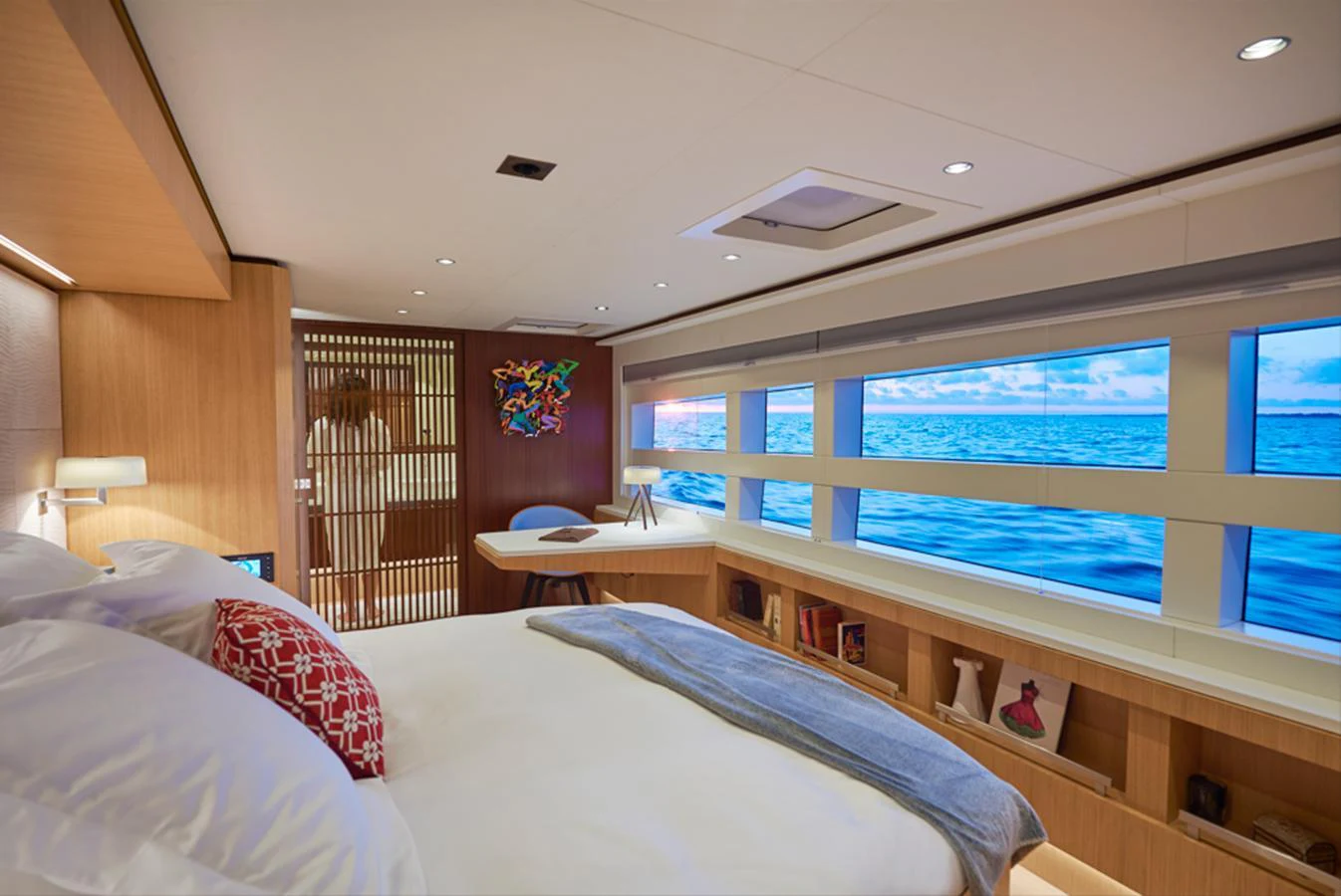 A luxurious stateroom with large windows offering stunning ocean views. aboard LONG ISLAND 78 Yacht for Sale