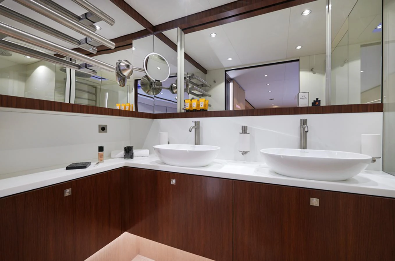 The yacht's bathroom features modern fixtures and a sleek design with dual sinks and ample counter space. aboard LONG ISLAND 78 Yacht for Sale