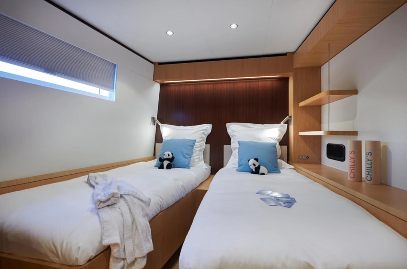 The twin stateroom offers a cozy and inviting space with plush bedding and modern decor. aboard LONG ISLAND 78 Yacht for Sale