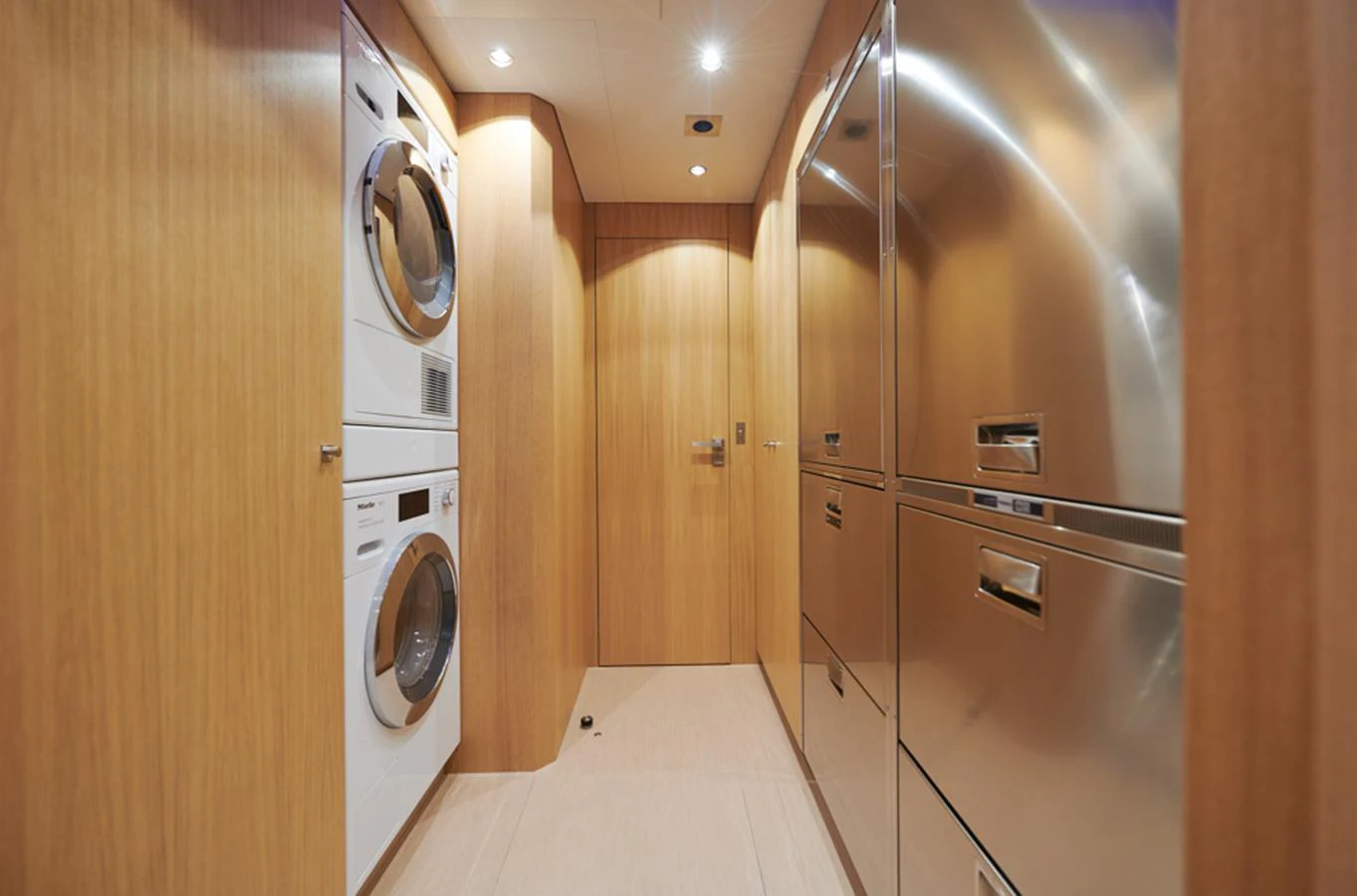 The yacht's laundry room features modern appliances and ample storage space. aboard LONG ISLAND 78 Yacht for Sale