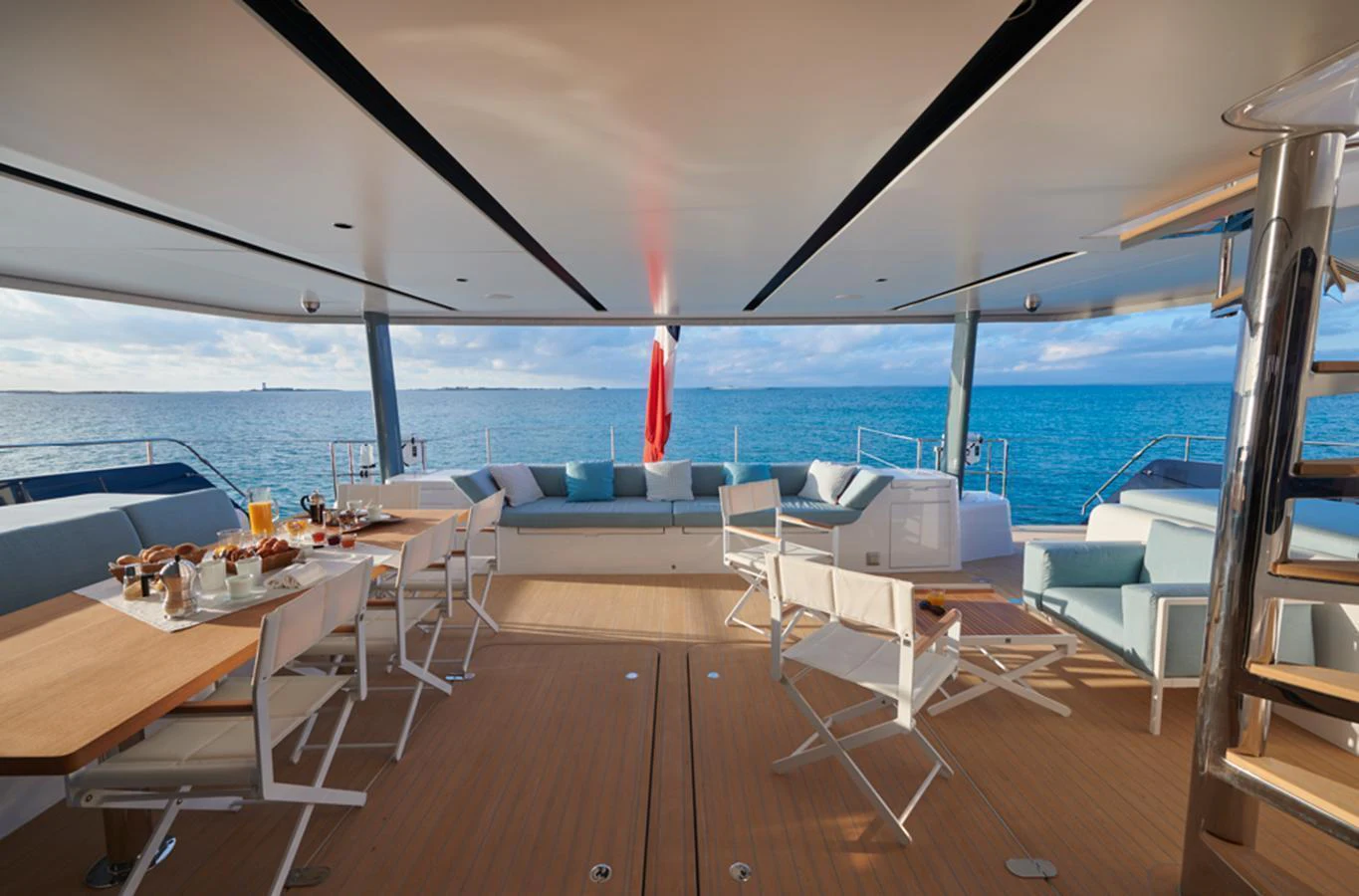 The aft deck offers a spacious and inviting area for dining and relaxation with stunning ocean views. aboard LONG ISLAND 78 Yacht for Sale