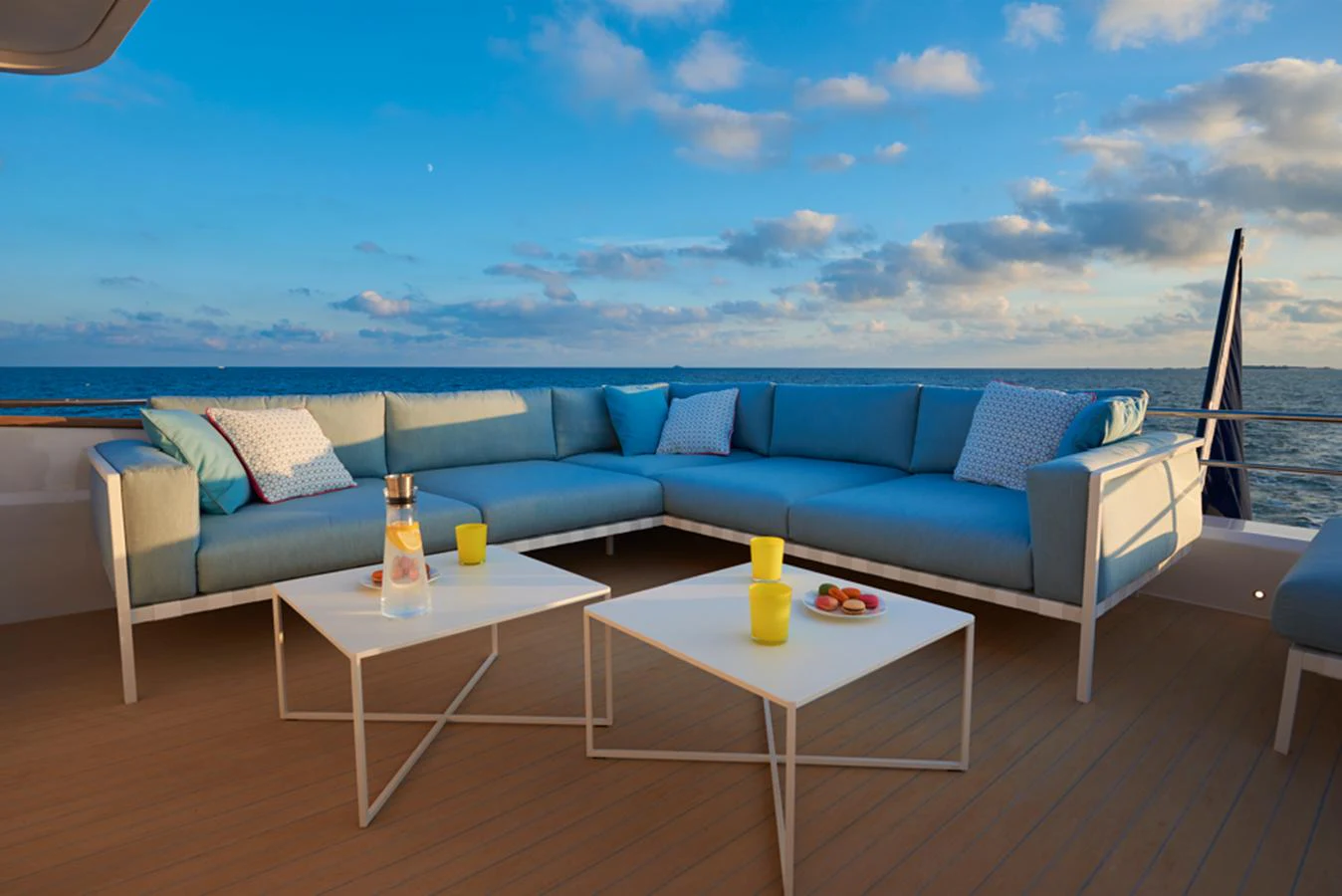 The aft deck features a stylish outdoor seating area with a stunning ocean view. aboard LONG ISLAND 78 Yacht for Sale