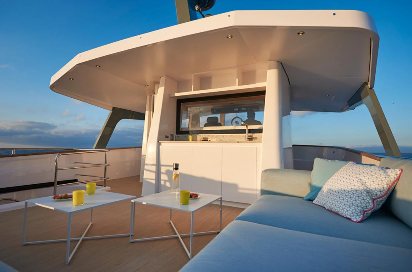 The flybridge offers a stylish and comfortable outdoor lounging area with modern furnishings and panoramic views. aboard LONG ISLAND 78 Yacht for Sale