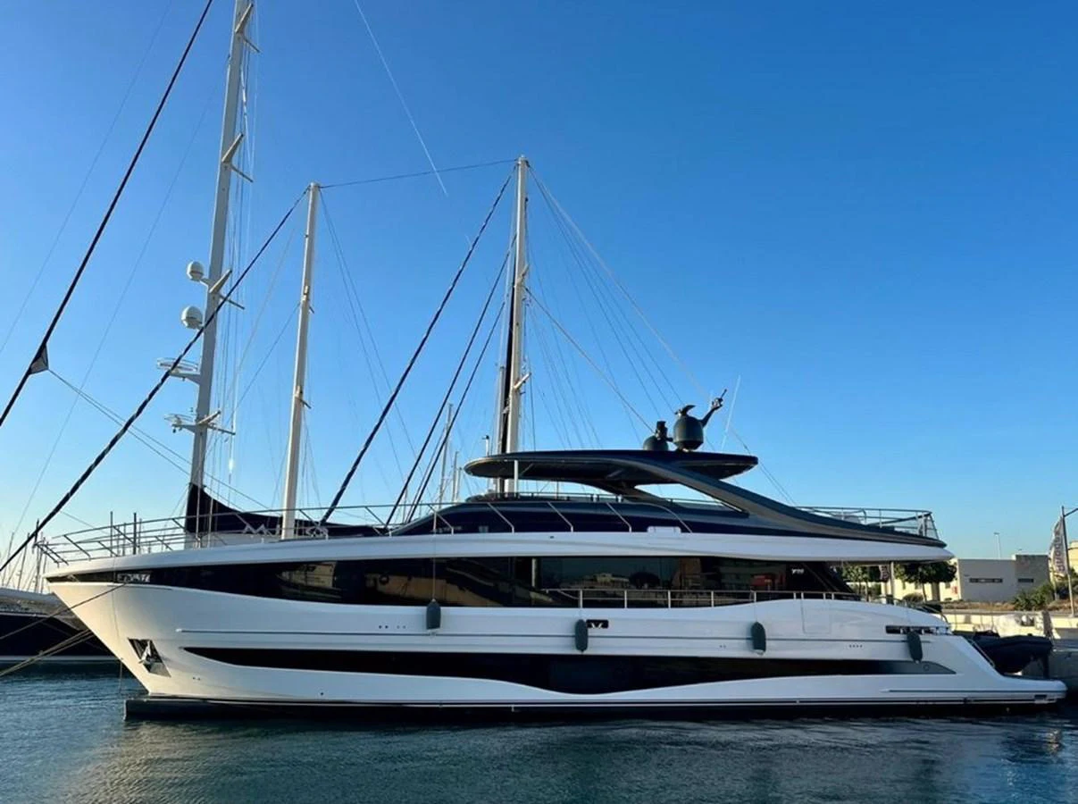 A sleek and modern yacht is docked at the marina, showcasing its elegant design and spacious decks. aboard LEILANI Yacht for Sale